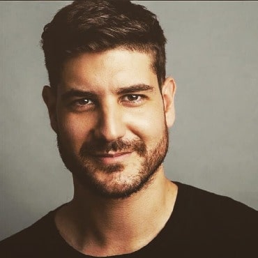 Claude Jabbour wearing black t-shirt with grown beard.